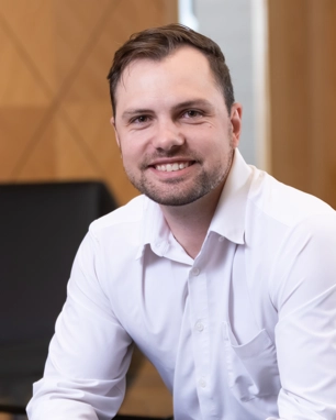 portrait of a smiling person in professional attire